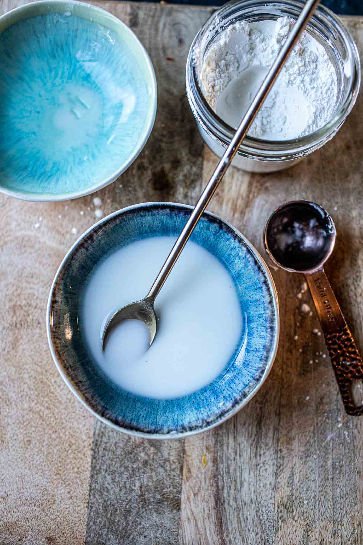 Cornstarch slurry in a blue bowl