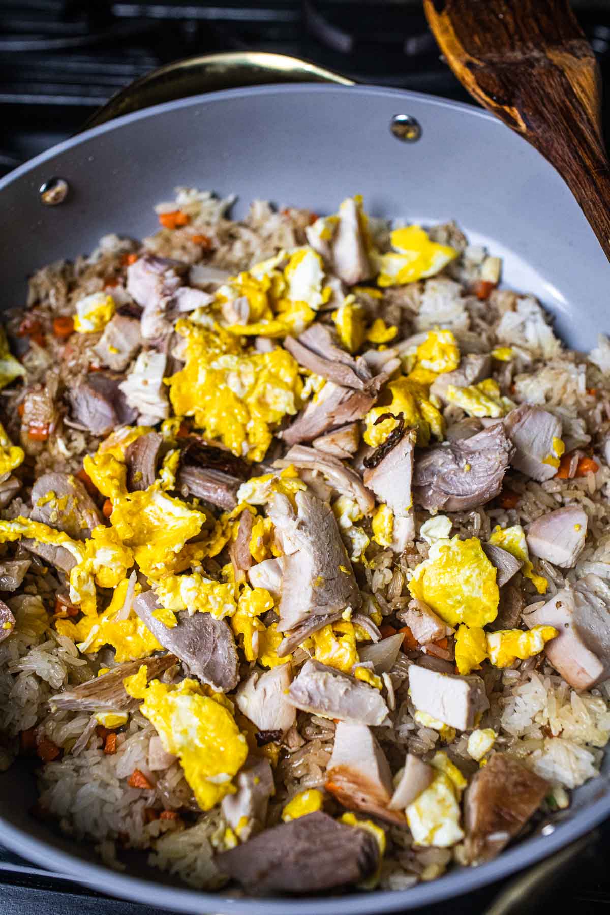 thai fried rice with turkey meat and eggs in a pan