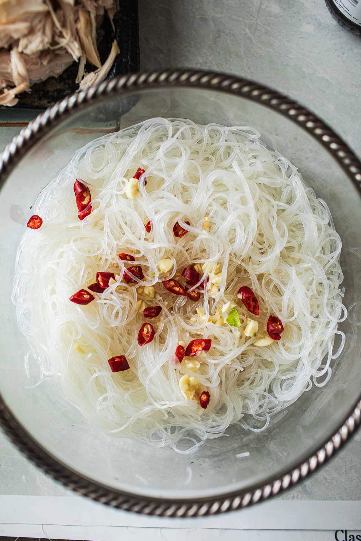 sauce over glass noodles in a bowl