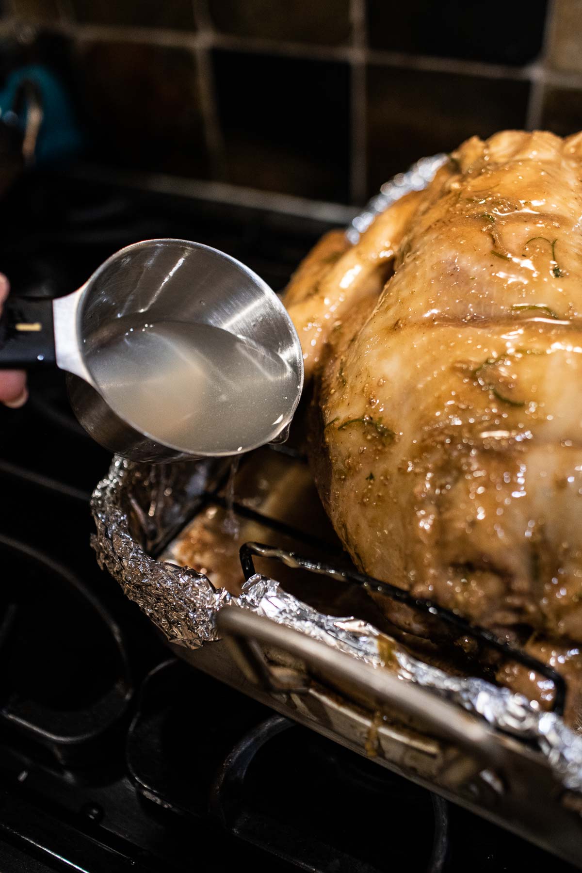 water poured over roasted turkey