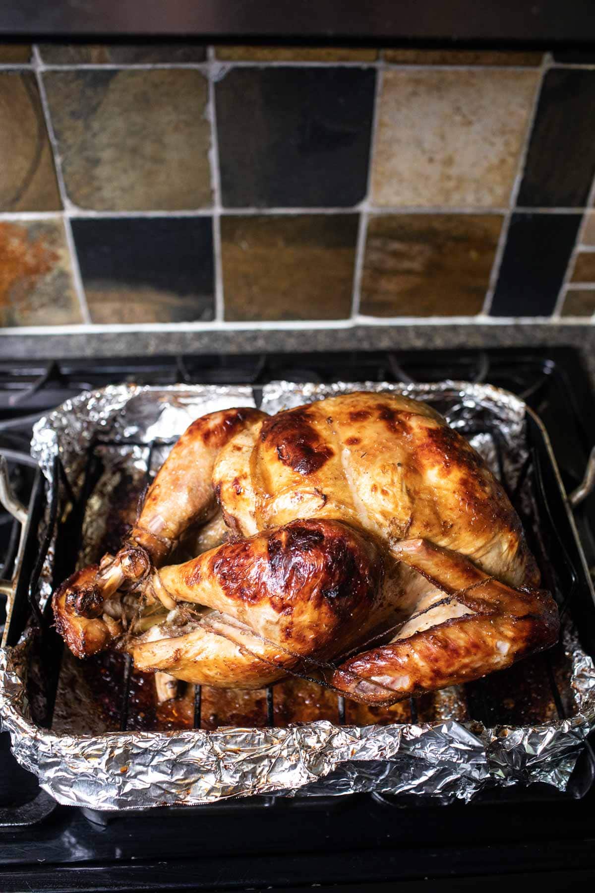 roasted turkey resting on the stove top