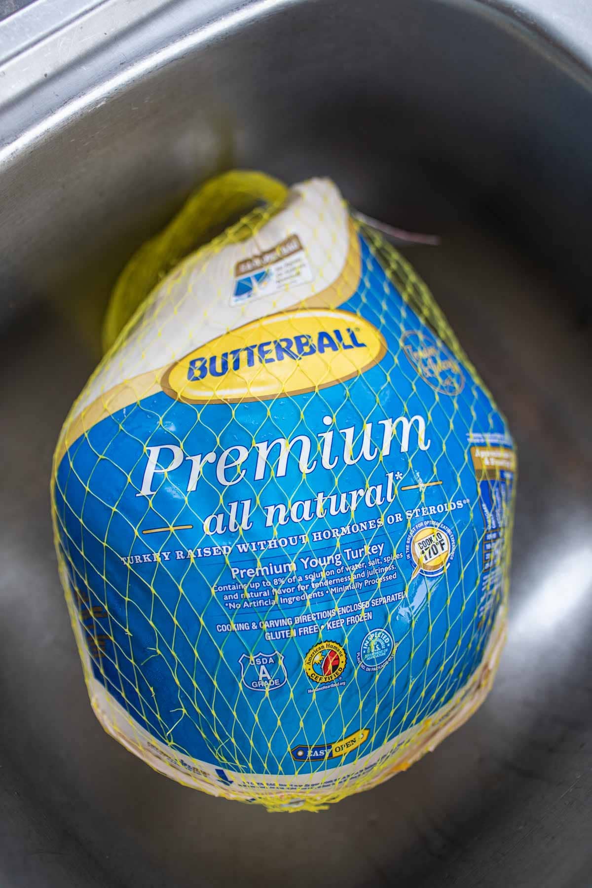 butterball turkey in a net in sink