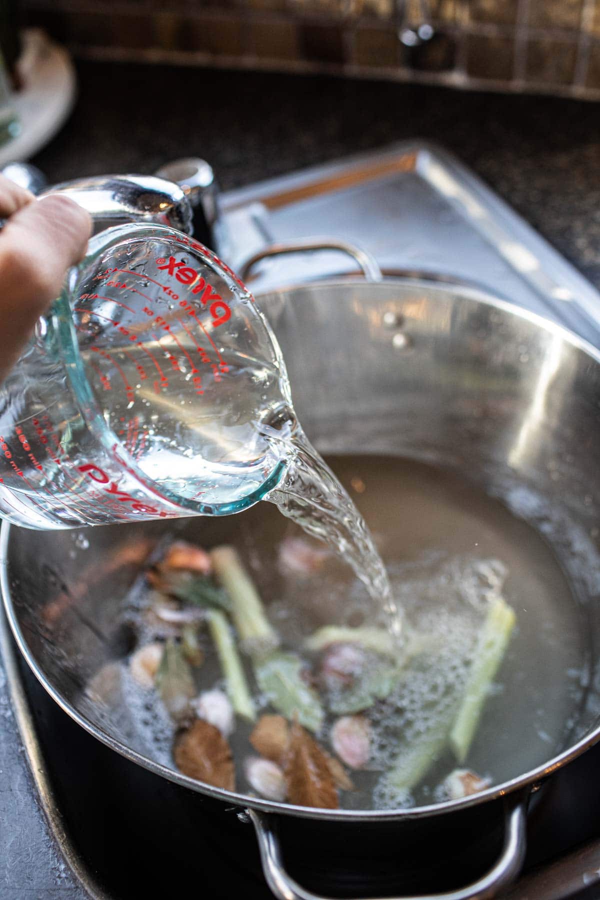 turkey brine with spices in an ice bucket