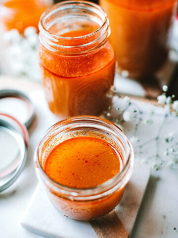 tom yum broth in glass jars