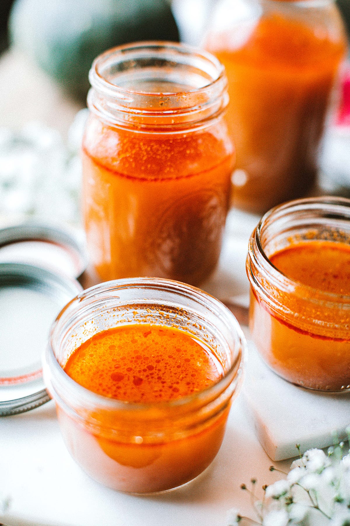 Tom Yum Soup Broth with Turkey Bones in glass jars on the table