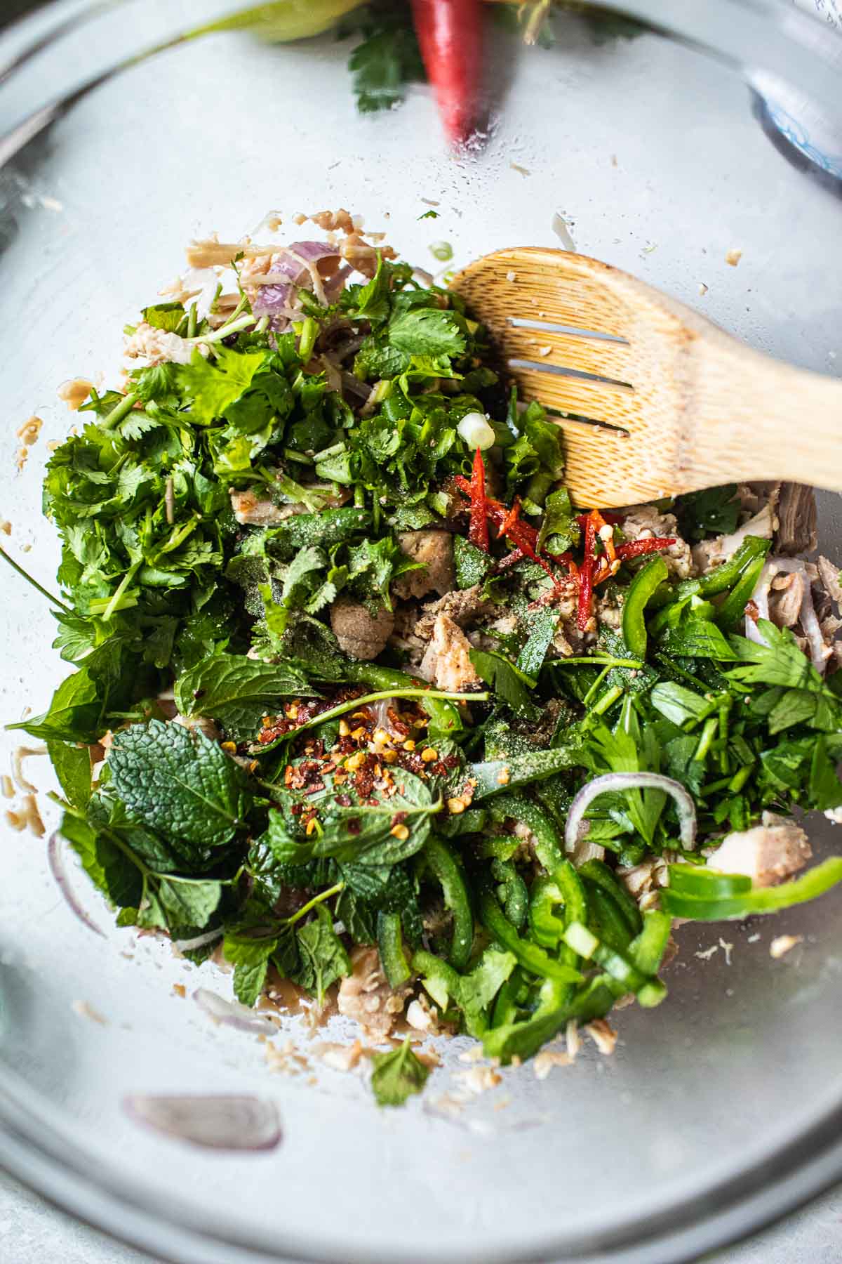 turkey larb in a bowl with herbs