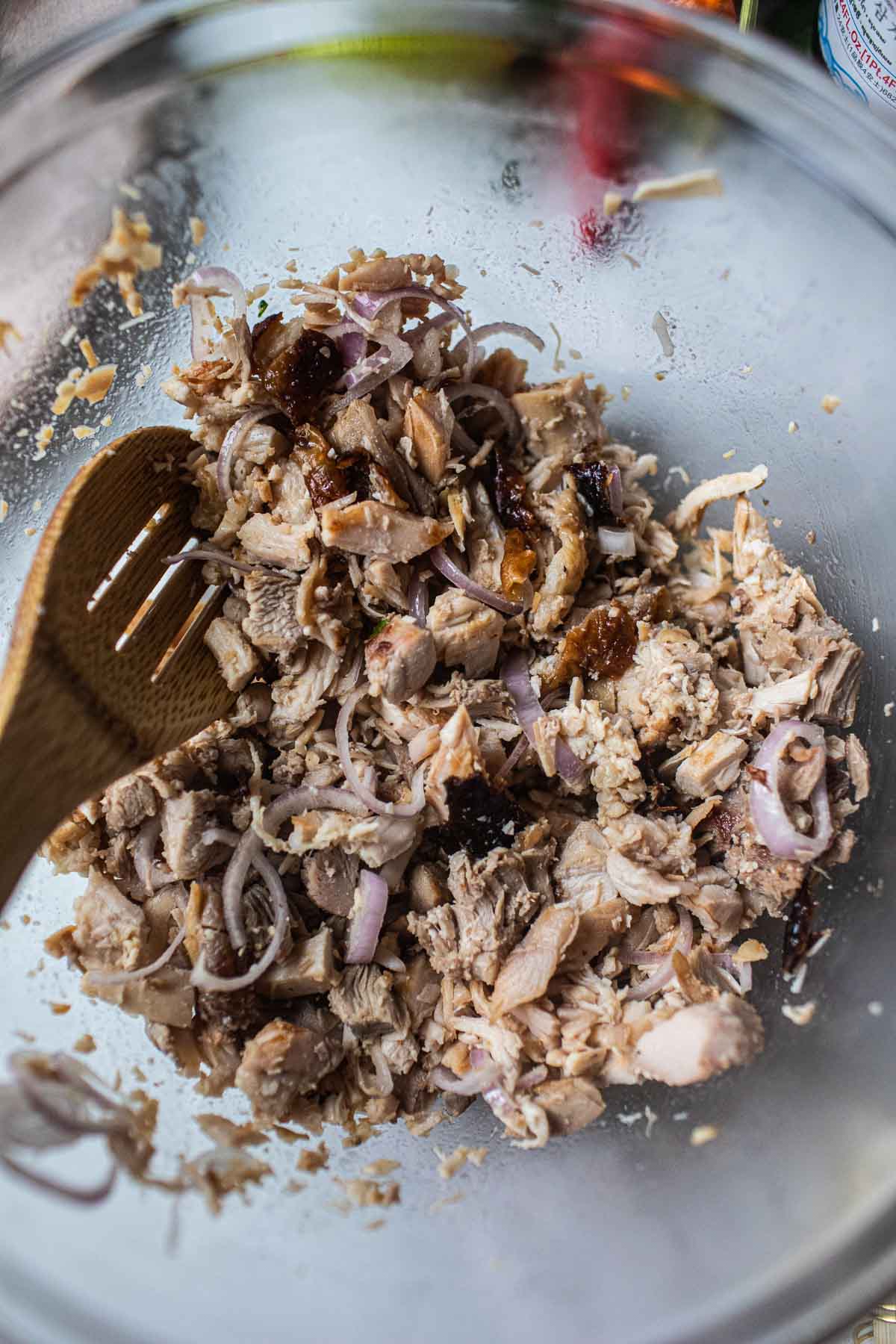 stiring thai turkey larb in a bowl 