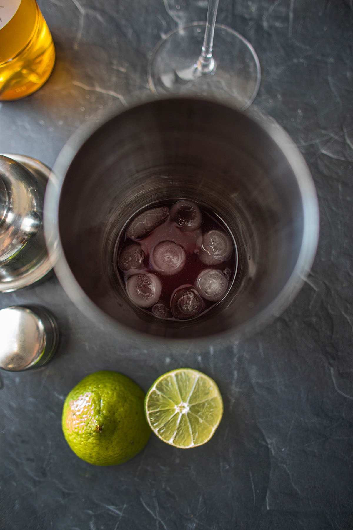 ice in a cocktail shaker for empress gin cocktail