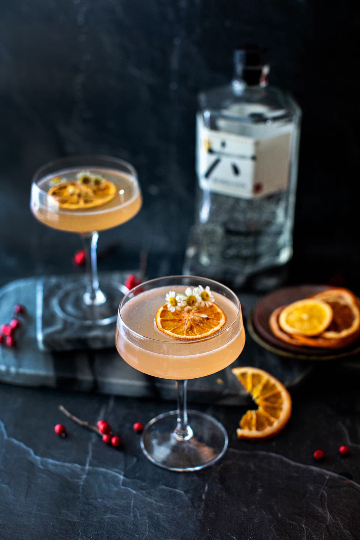 2 Roku gin tonic cocktails on a dark table