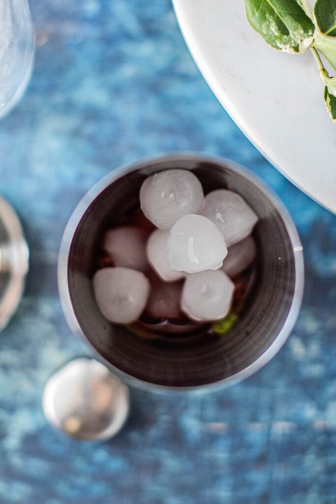 ice for shaking with strawberry gin and tonic in a mixer