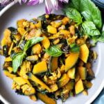 Thai kabocha squash stir fry on a gray plate