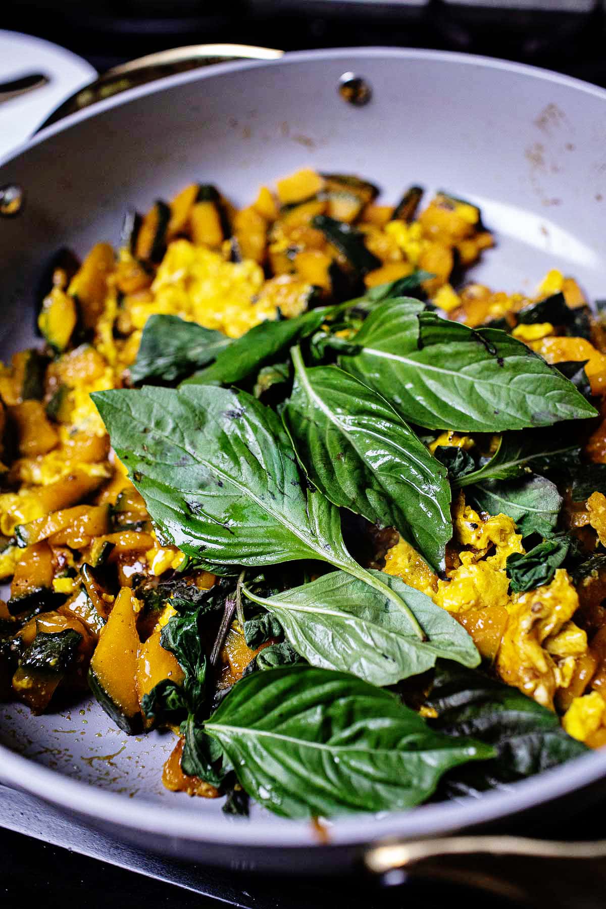  kabocha stir fry with basil in a pan