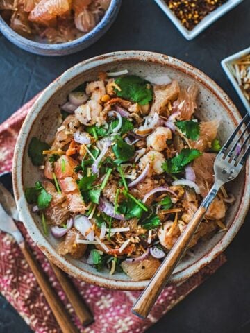 Thai pomelo salad on a plate with a fork