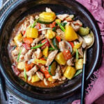 Easy sweet and sour chicken on a plate with a spoon.