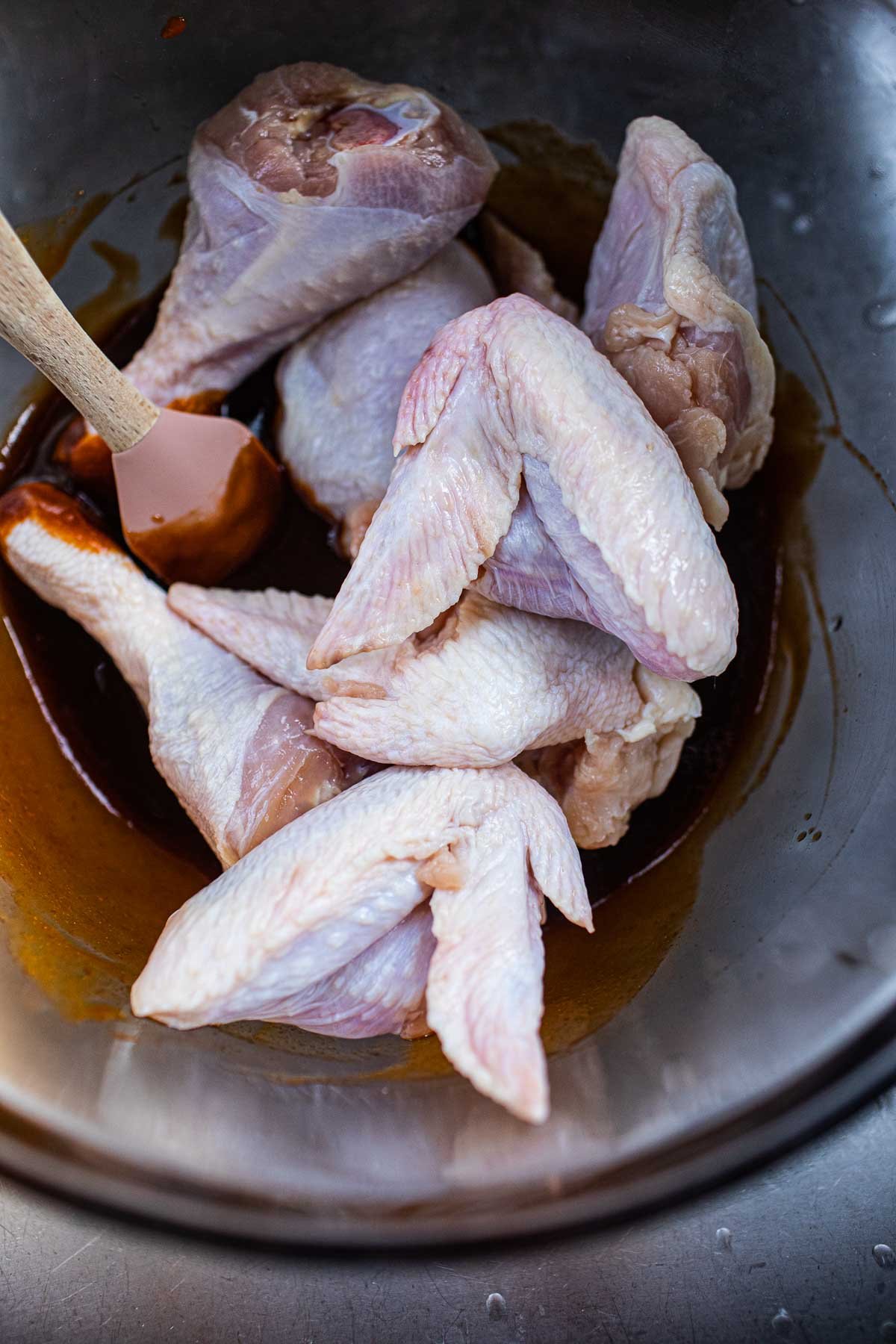 wings with hoisin sriracha sauce in a bowl.