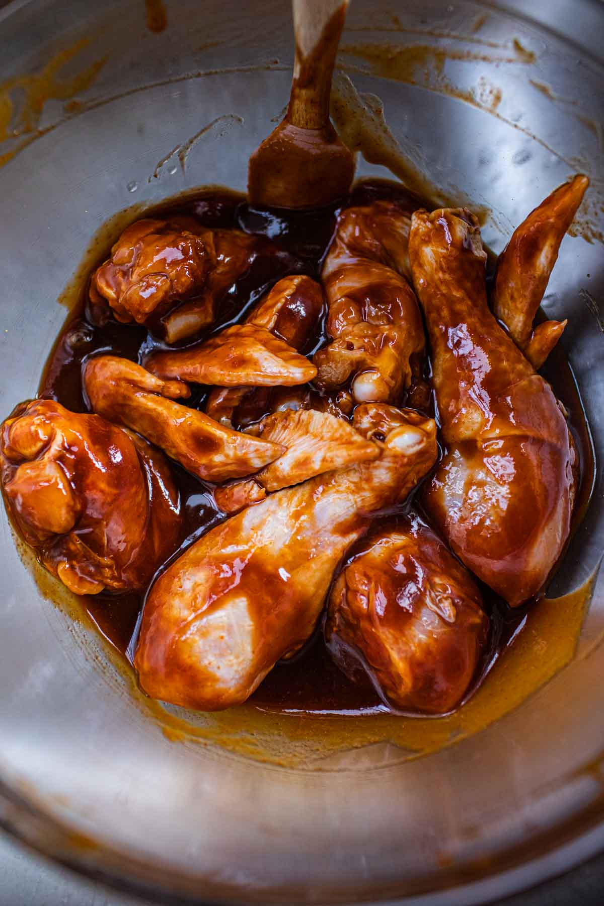 Sriracha wings in a bowl.