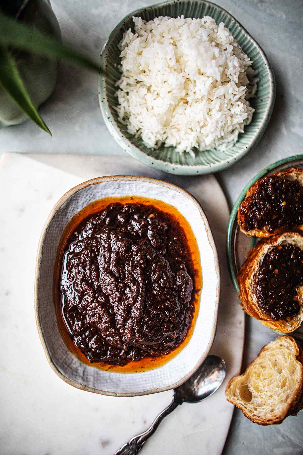 Nam Prik Pao in a bowl with toast and rice. 