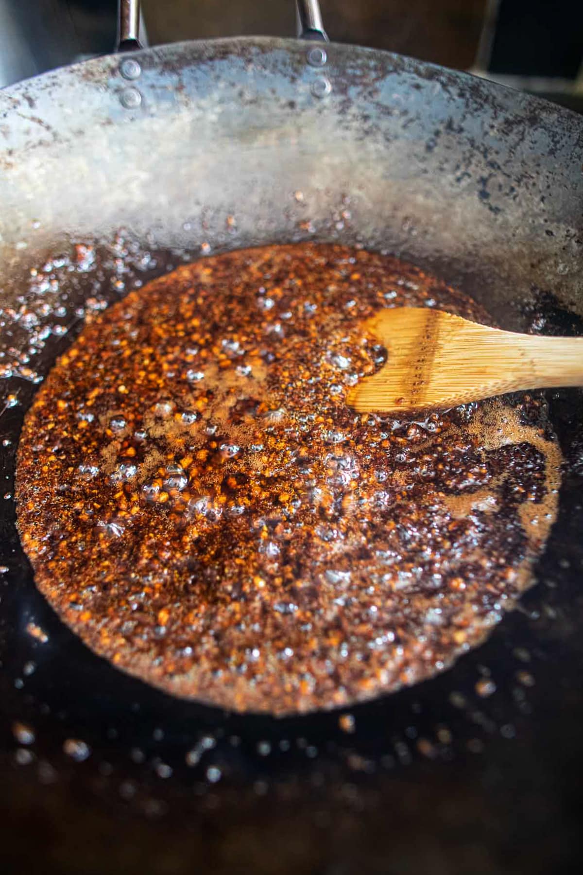 Nam Prik Pao Paste frying in a wok.