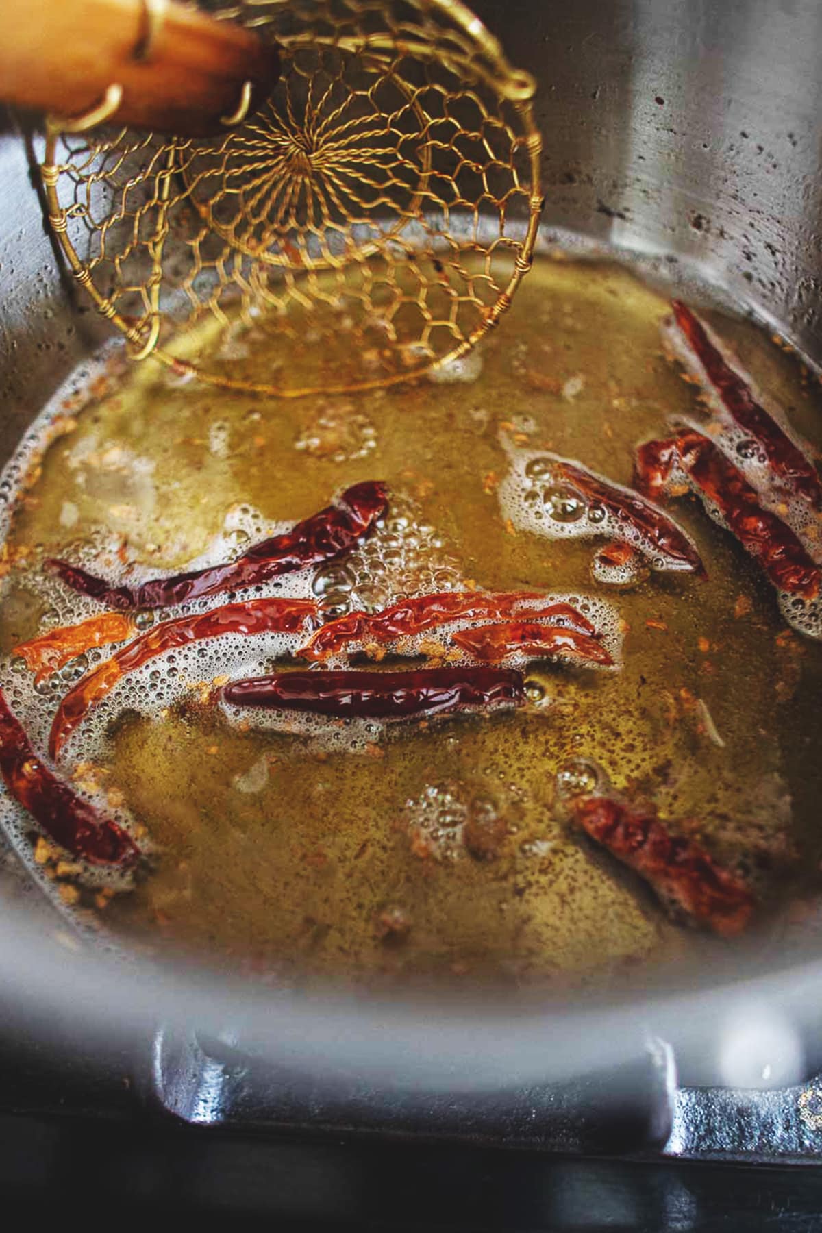 Fried red chilis in oil.