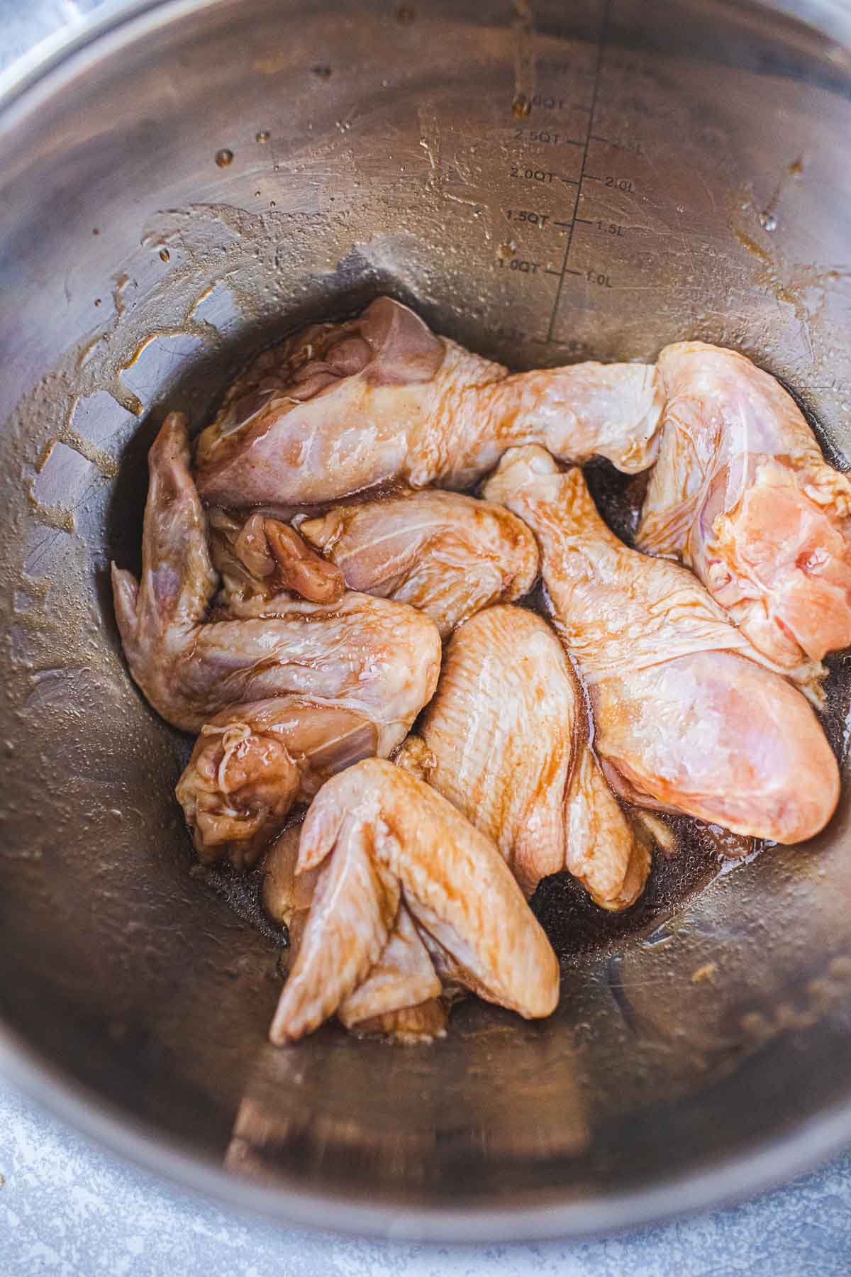 wings  in a bowl for baking. 