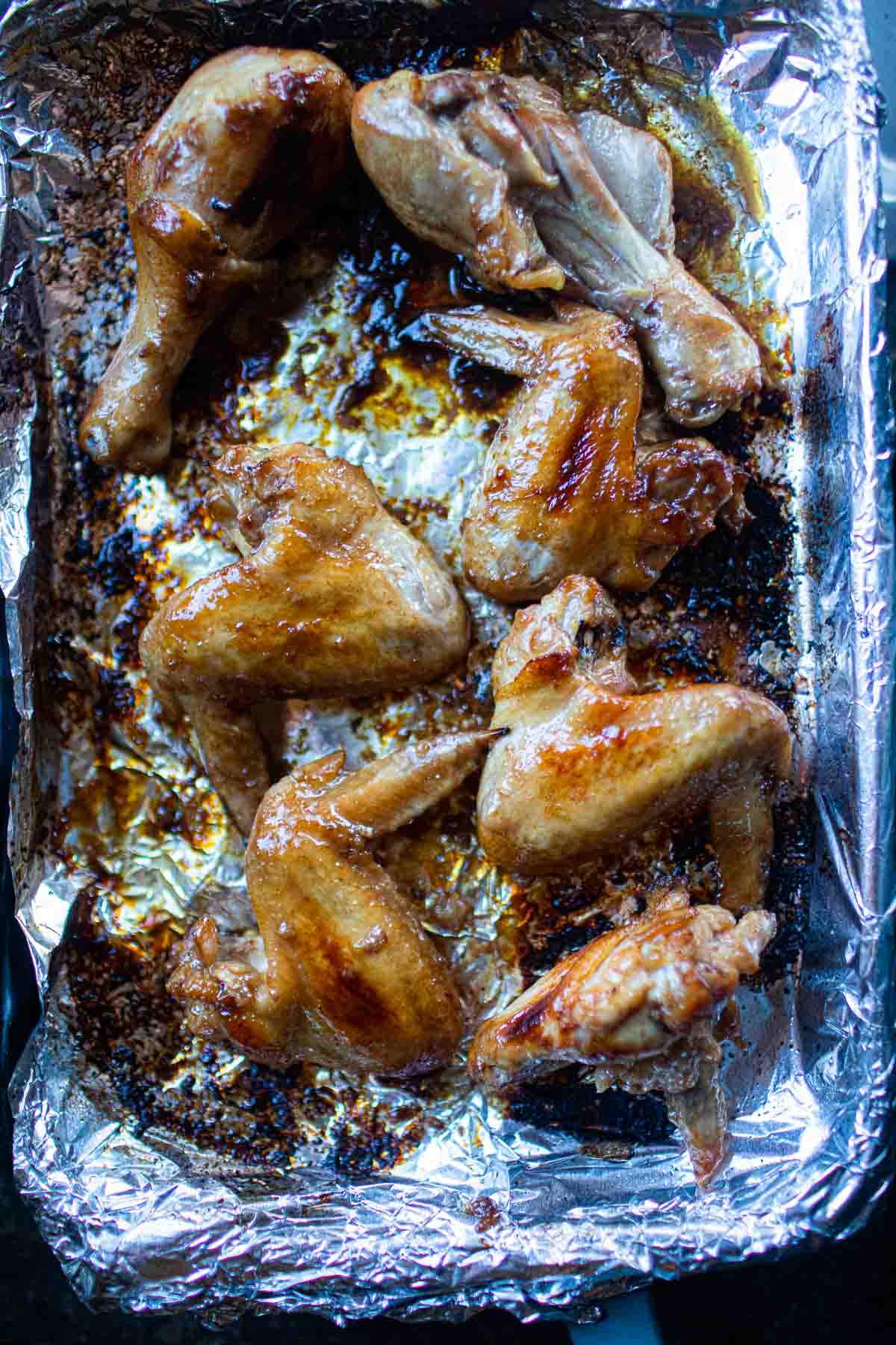 baked wings on a sheet pan over foil.