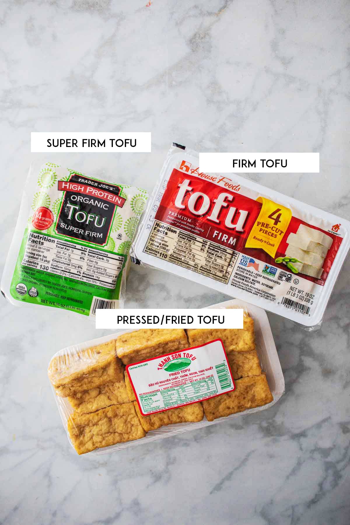 3 Firm tofu types on a table.