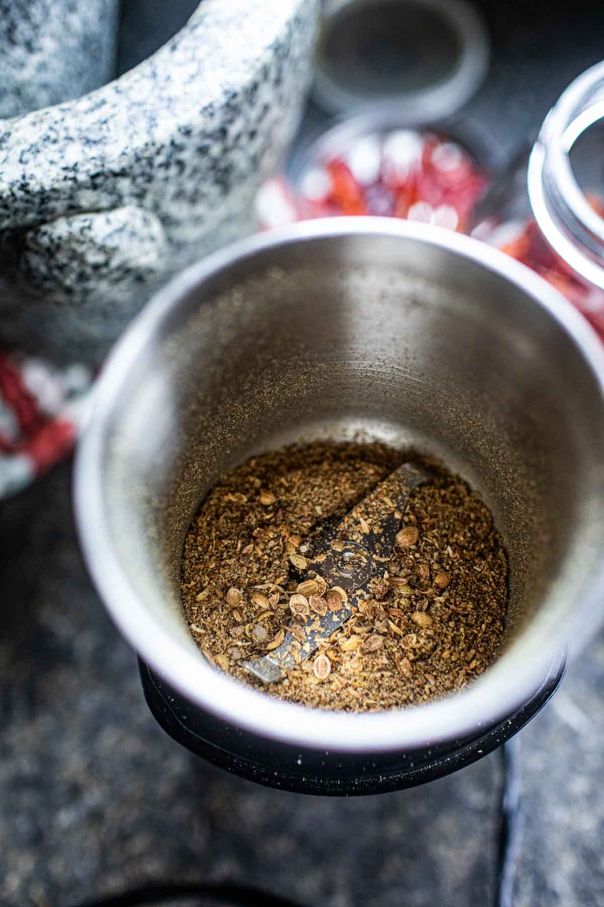 Ground spices in a spice grinder. 