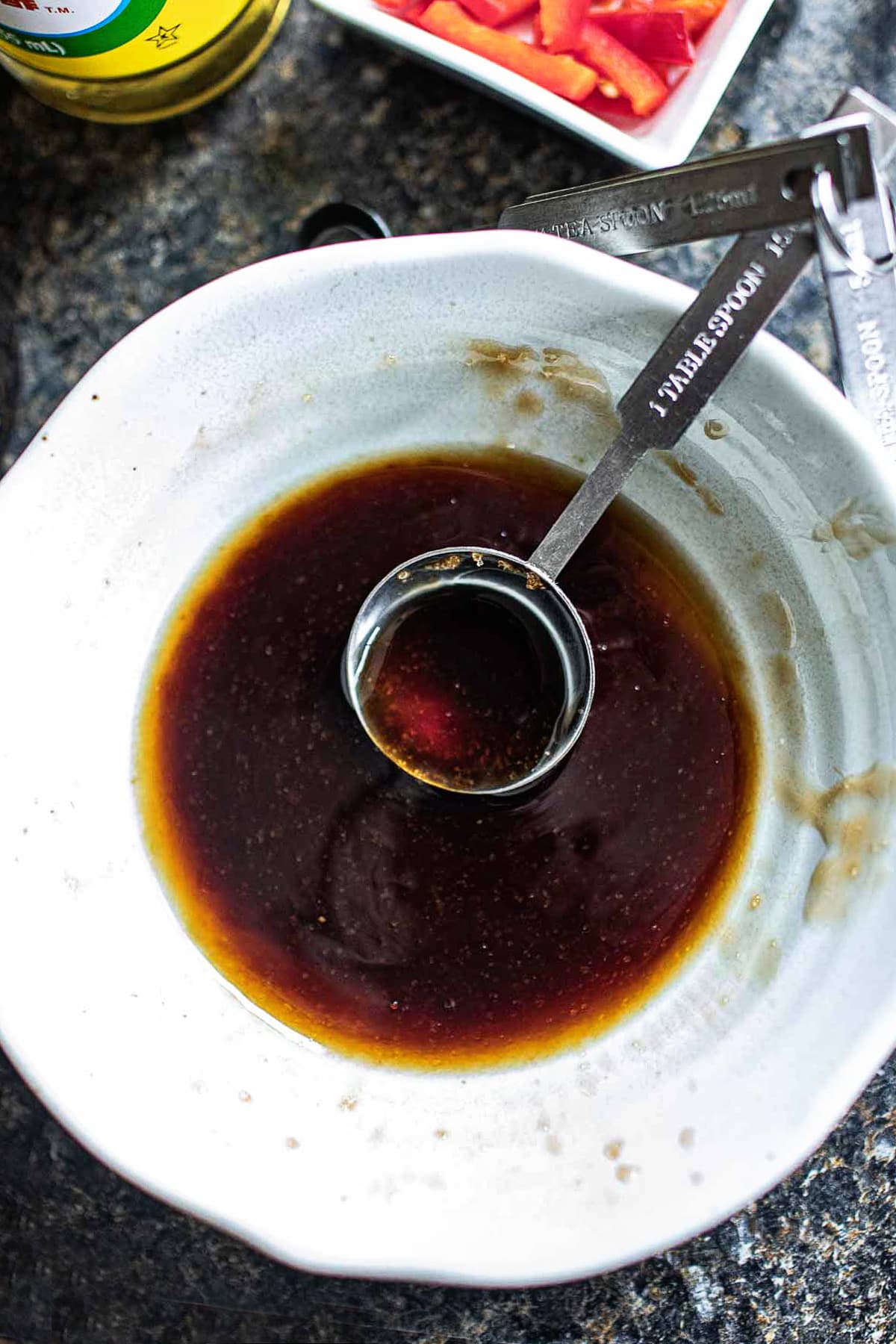 sauce in a white bowl on a counter. 