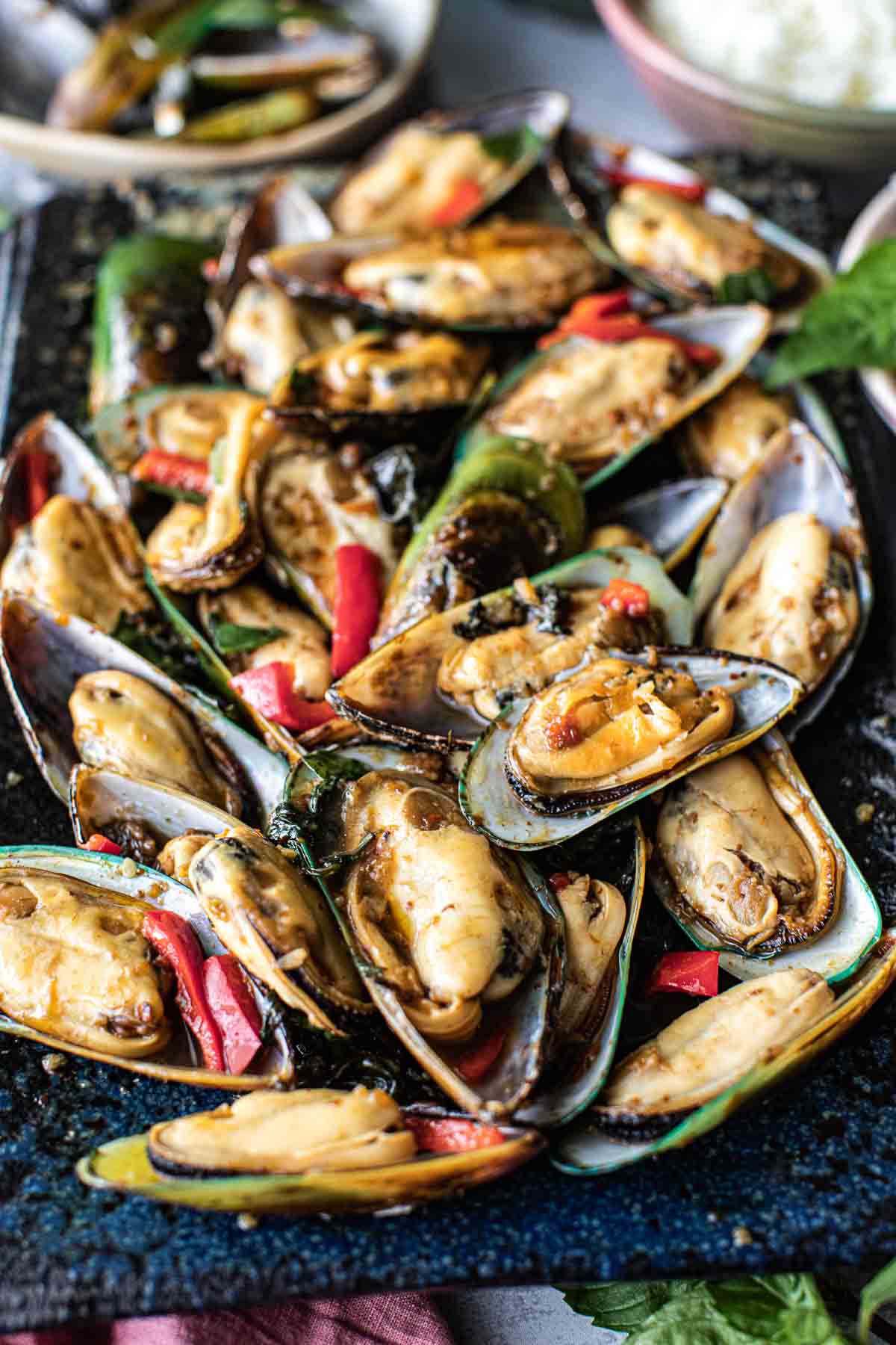 Thai Spicy mussels stir fry on a plate.