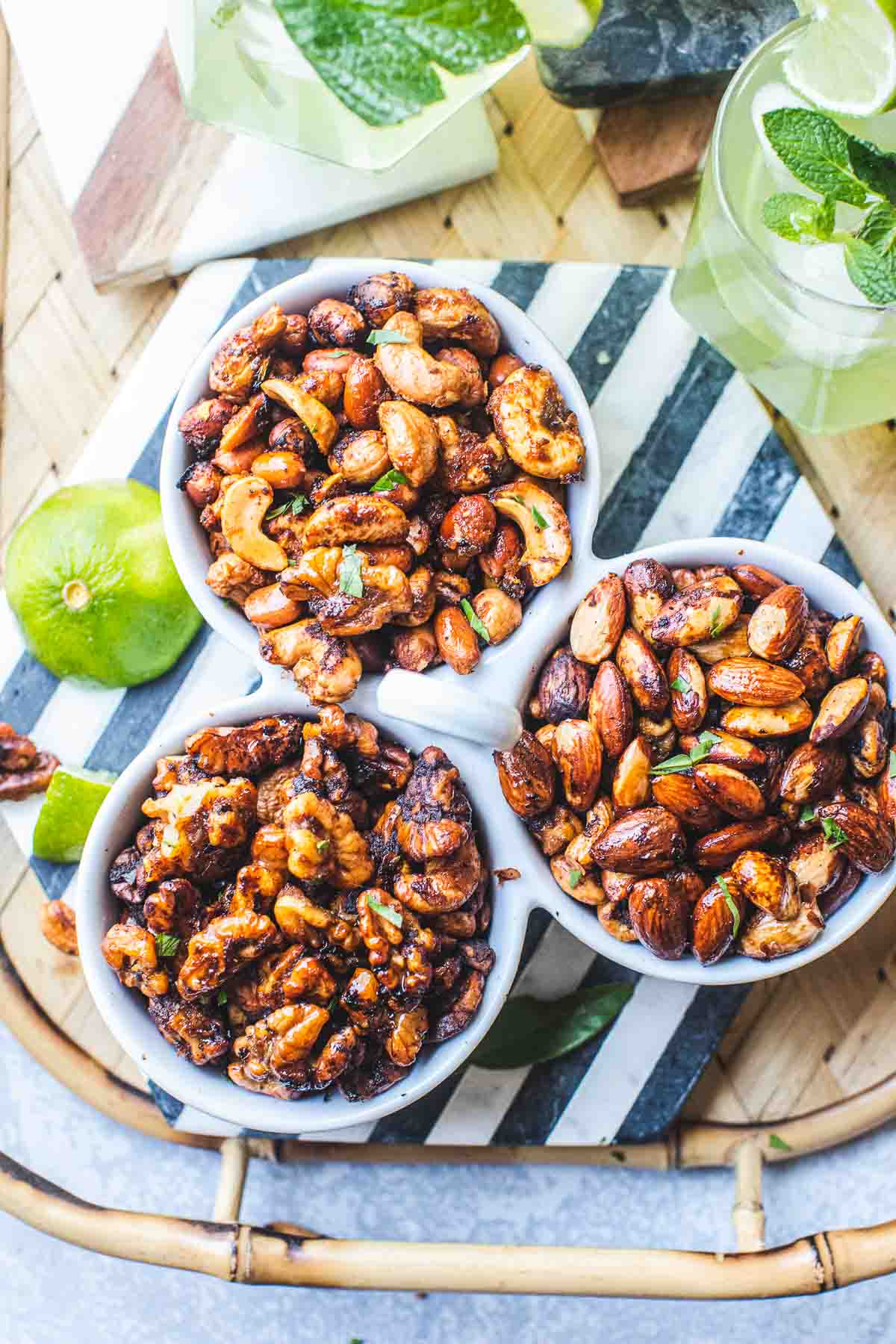 Tom yum roasted mixed nuts in bowls on a tray.