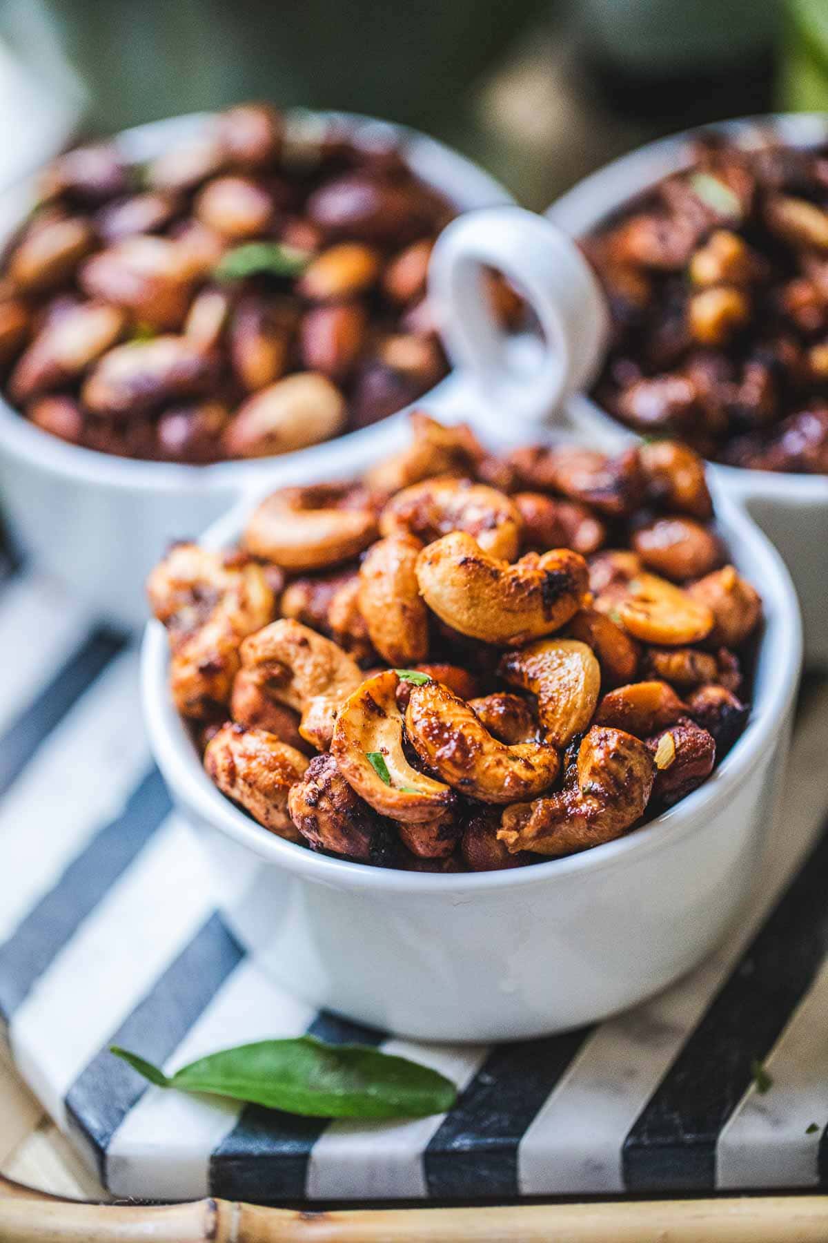 Tom yum roasted nuts in  small bowl.