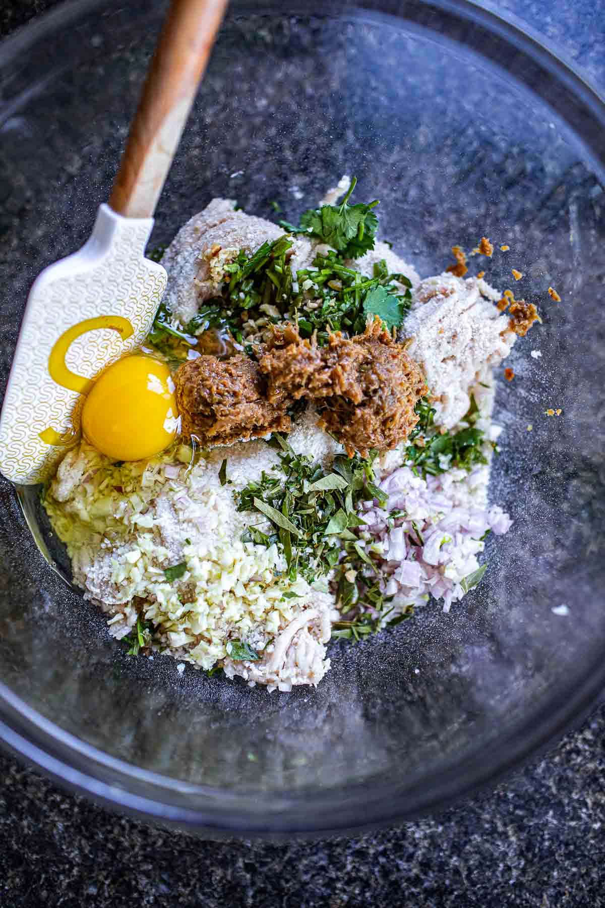 Tom Yum Meatballs in a glass bowl on the counter. 