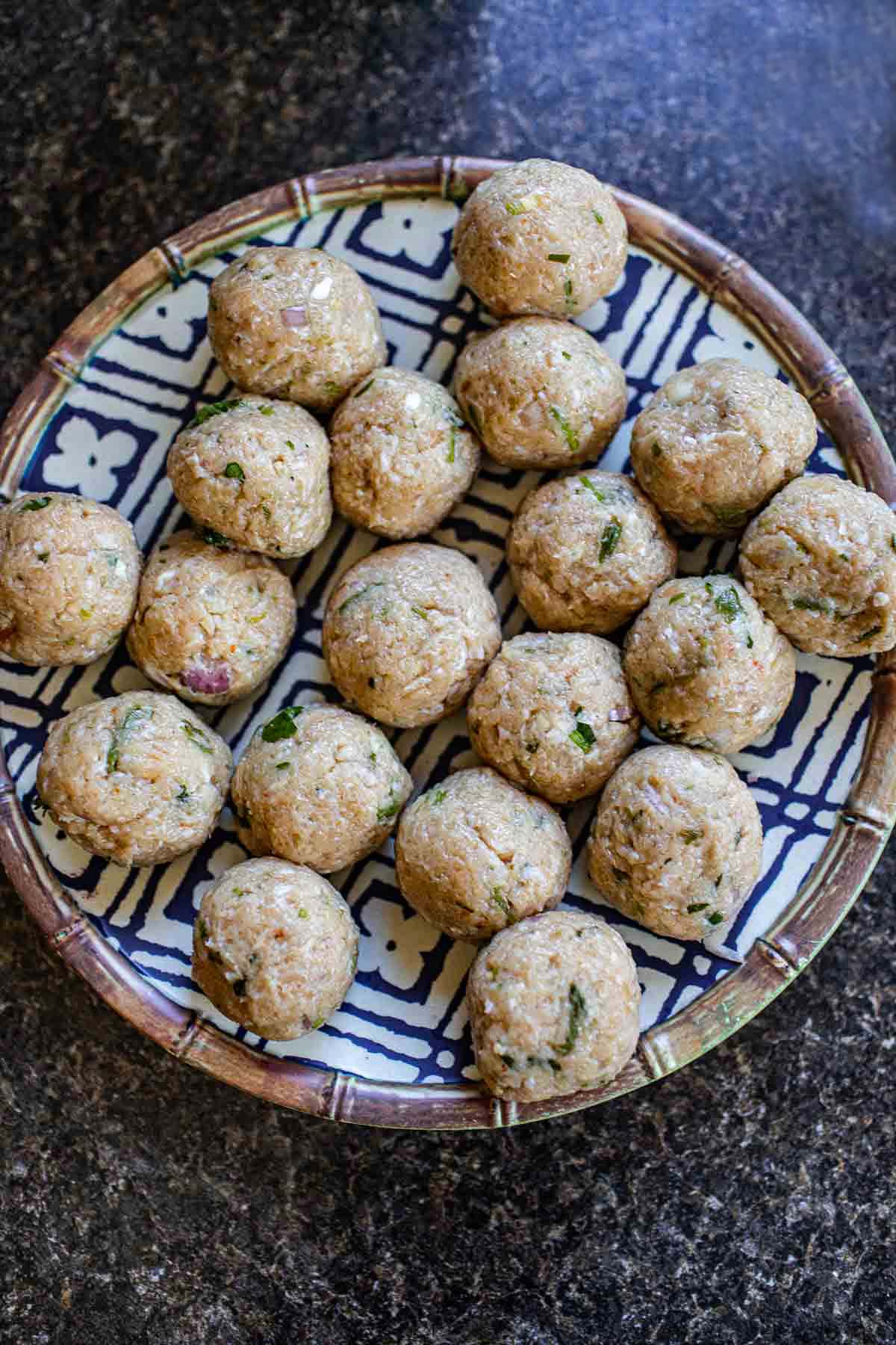 Tom Yum Meatballs on a plate on the counter. 