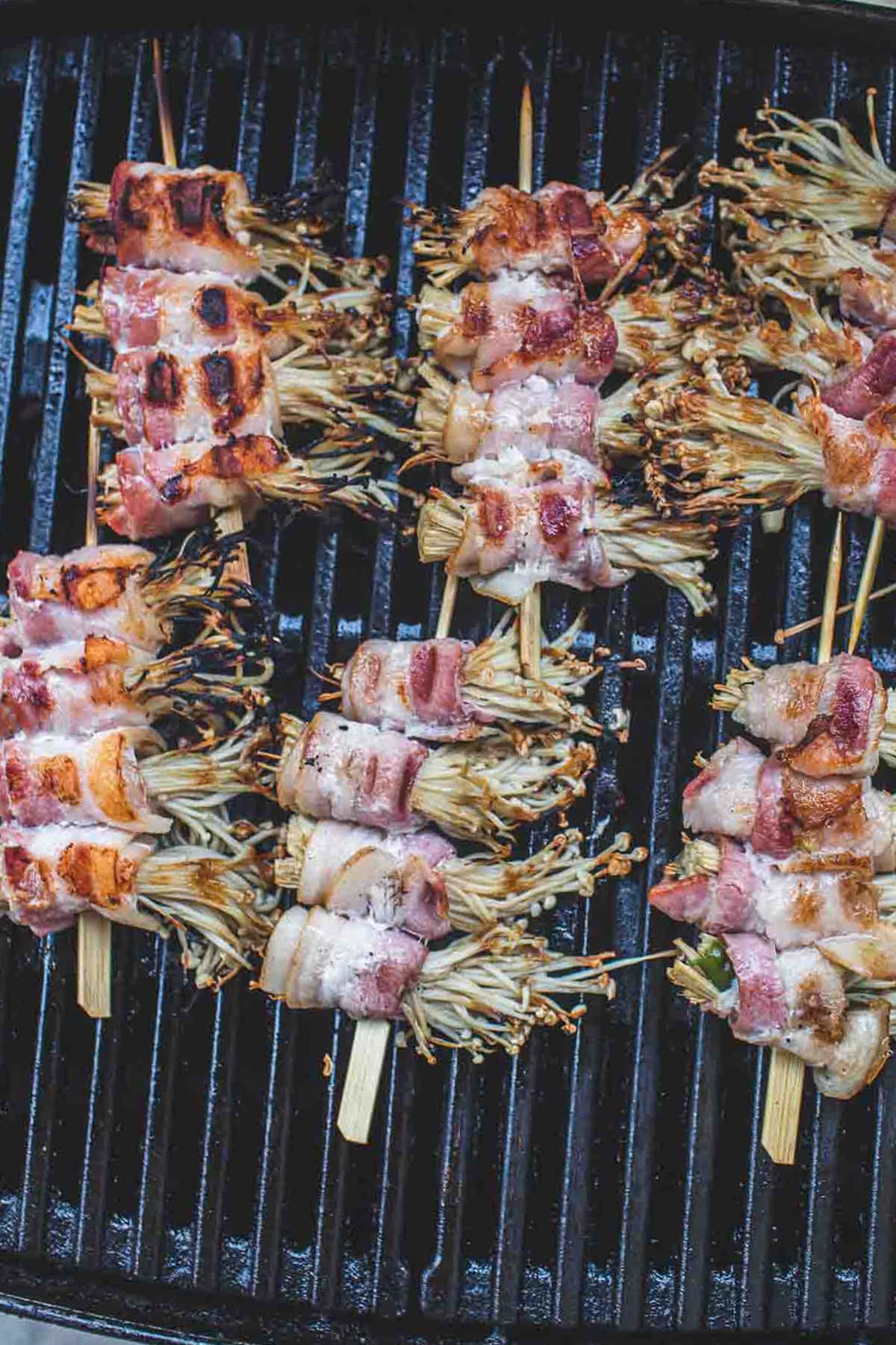 Enoki and bacon skewers on the grill.