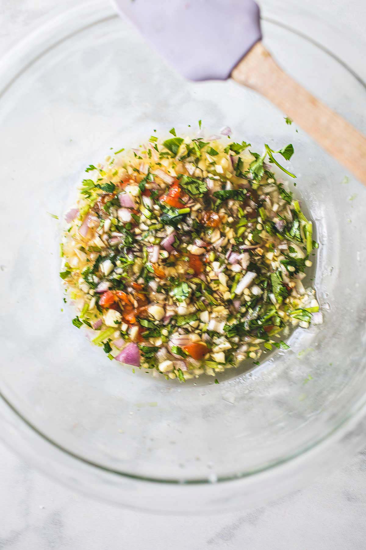 Chili dipping sauce in a glass bowl.