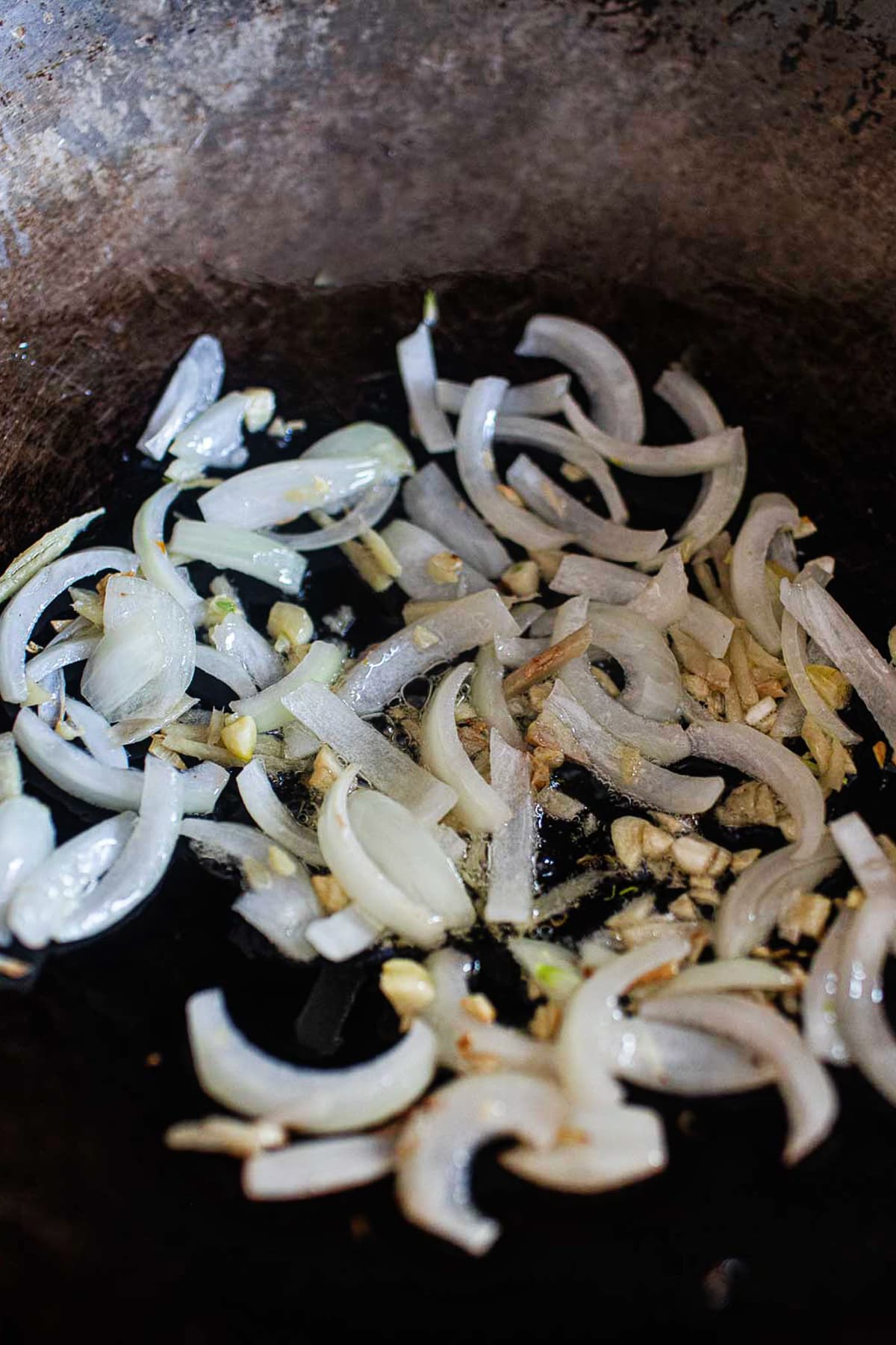 Ginger and onion stir fry in a wok.