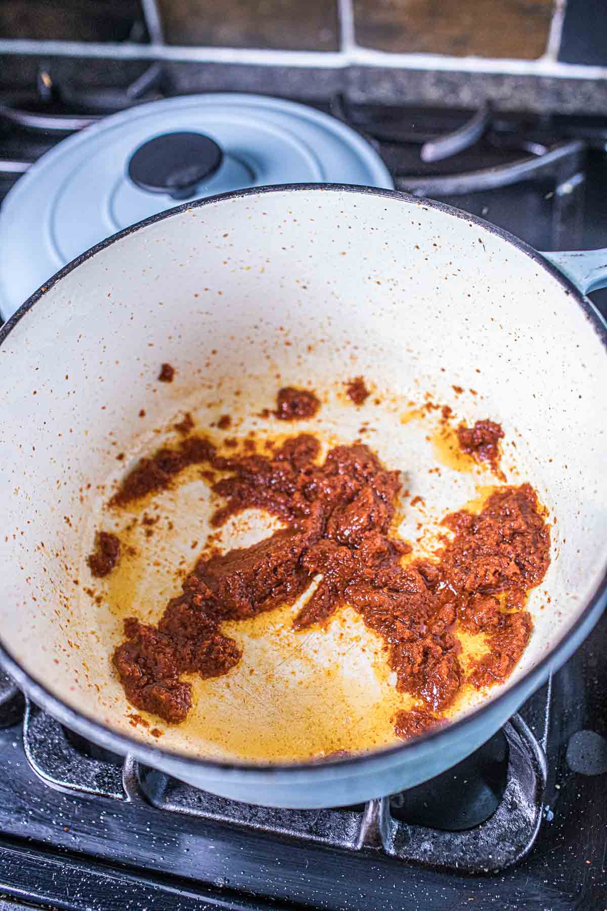 Panang curry paste frying oil in a pot. 