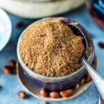 Panang curry paste in a bowl with a spoon.