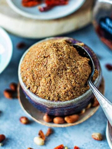 Panang curry paste in a bowl with a spoon.