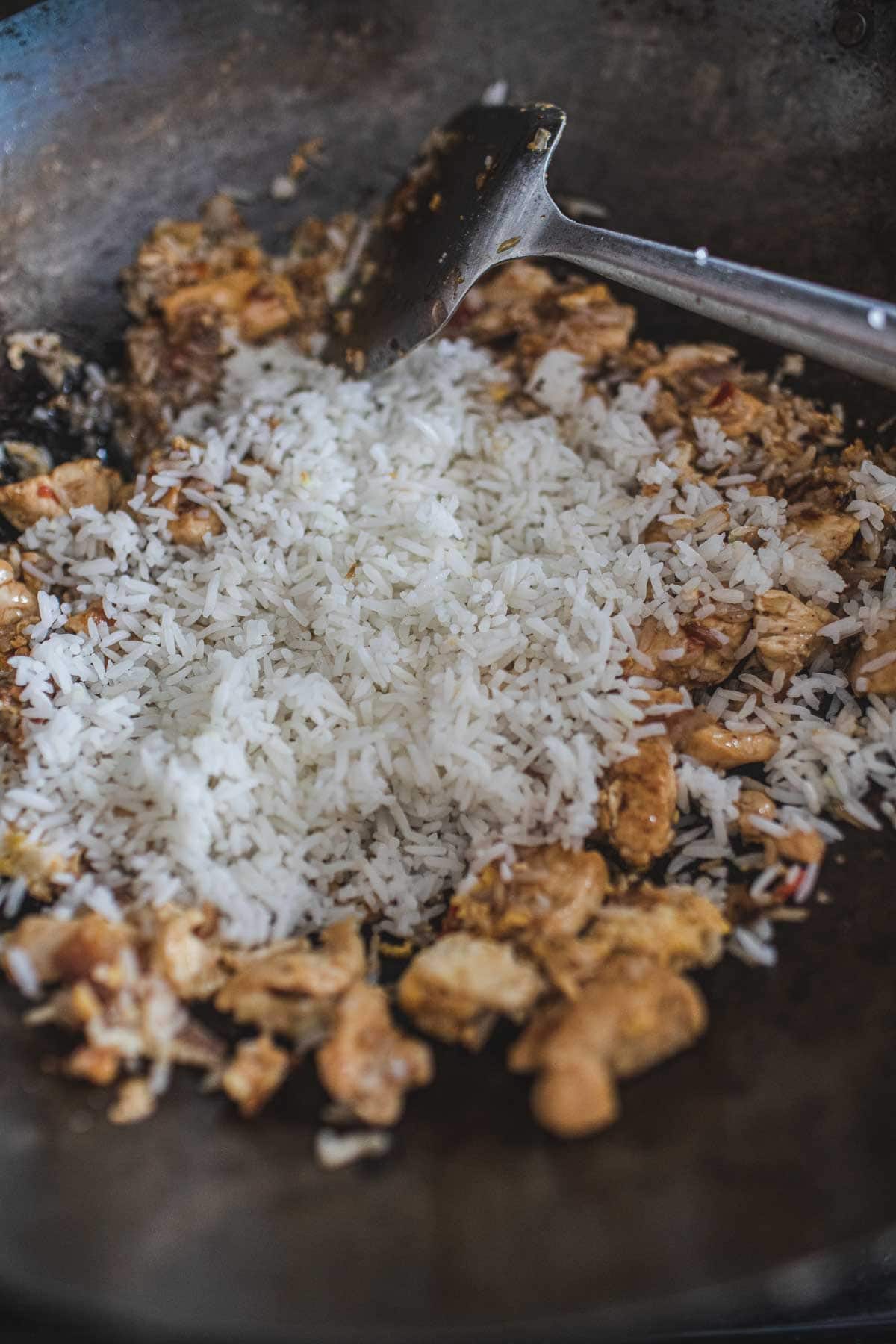 Thai chicken fried rice in a wok.