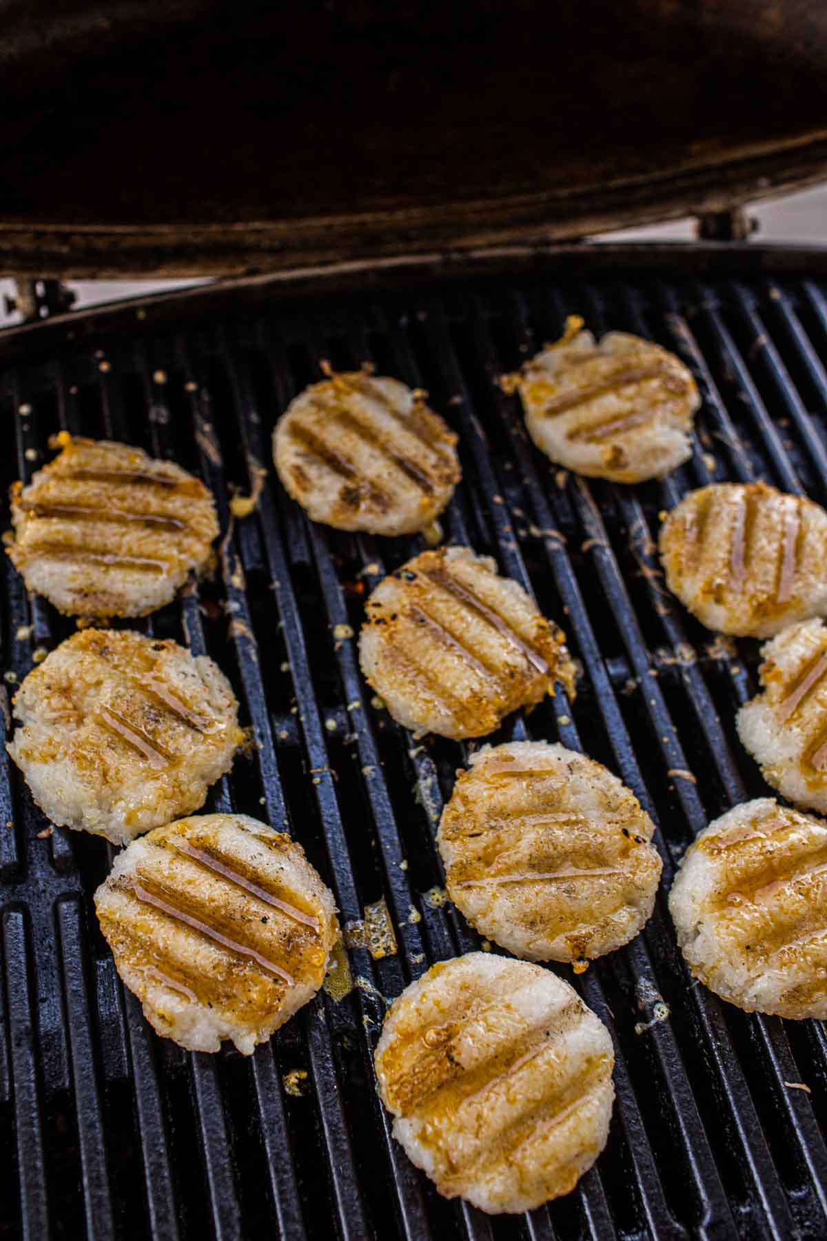 Grilled sticky rice patties on the grill.