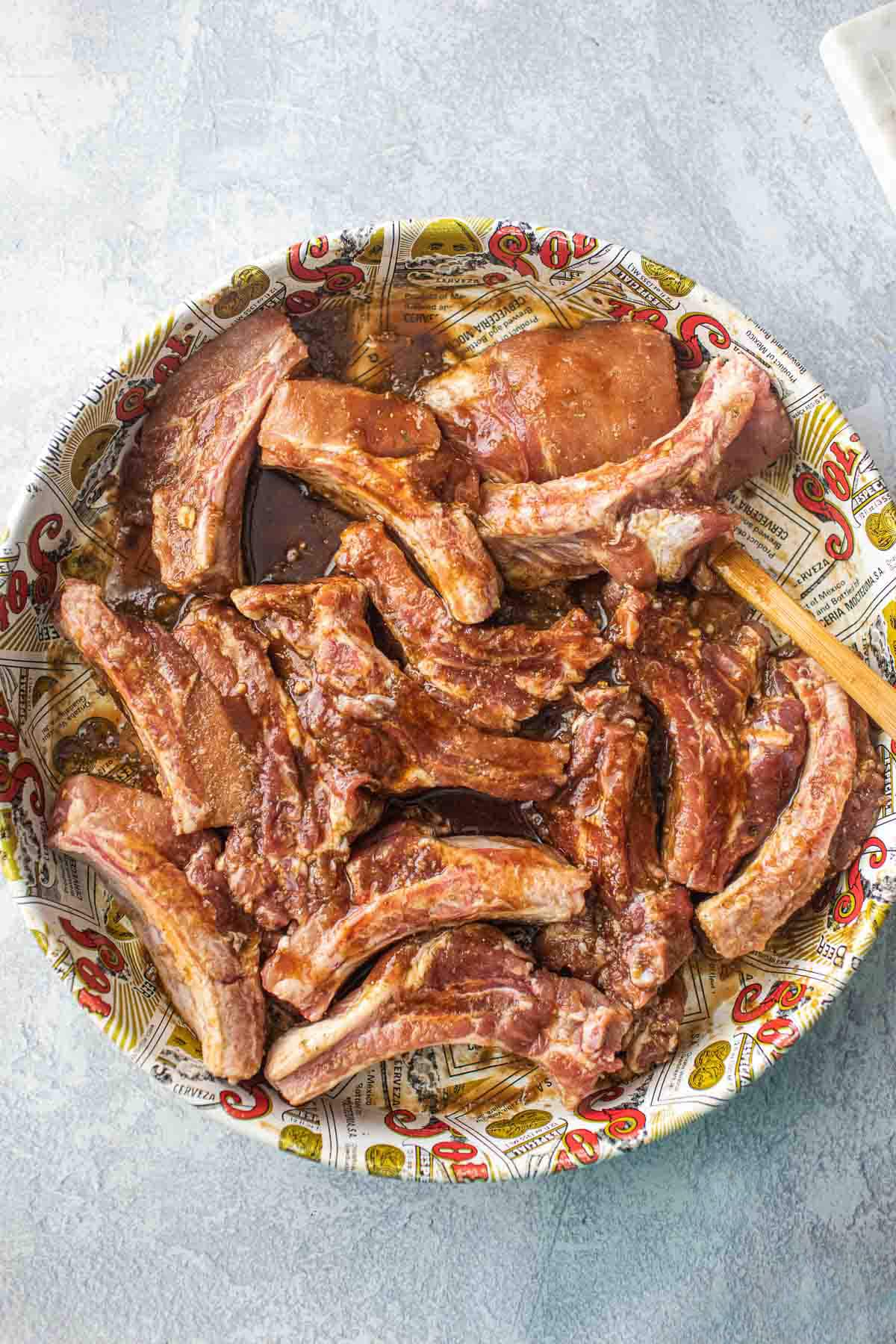 Marinated pork ribs in a platter.