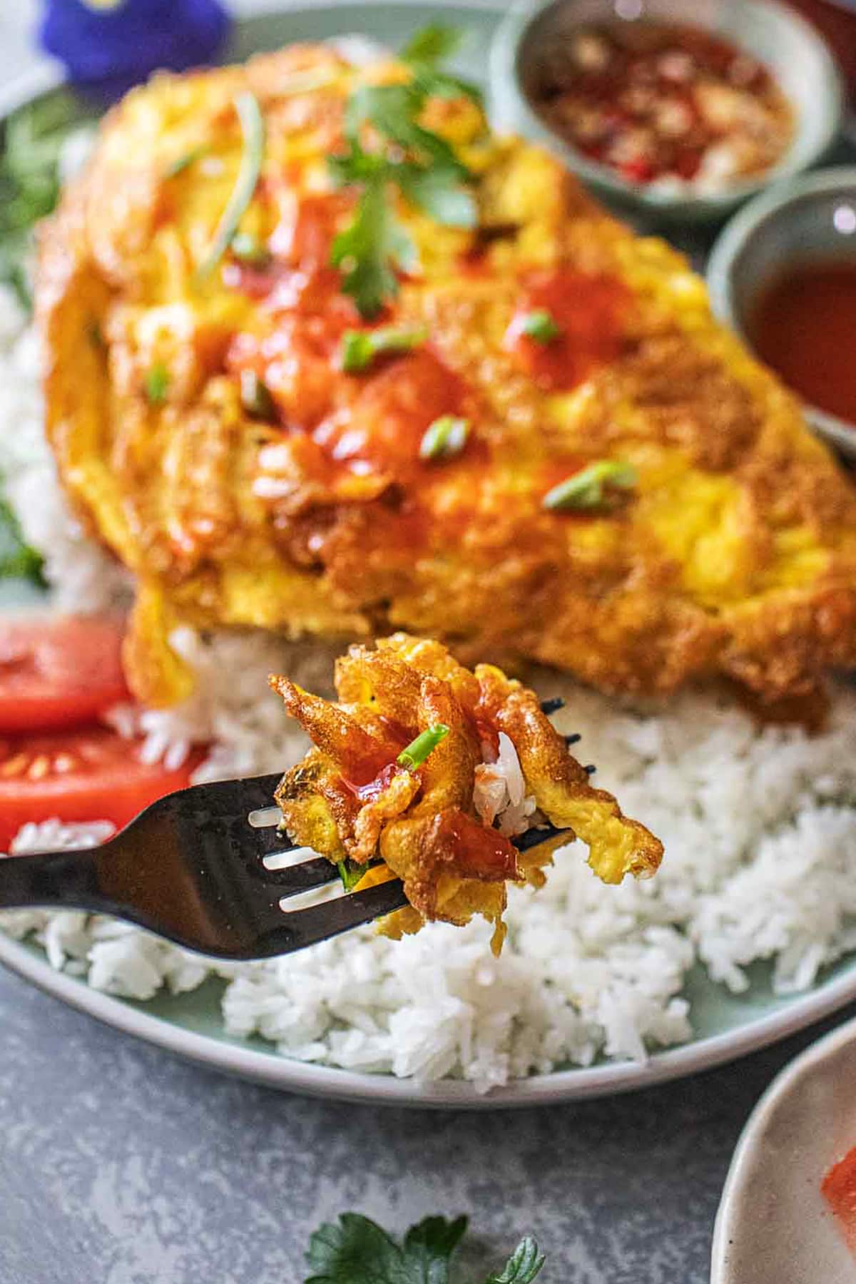 Crispy Thai omelette in a fork. 