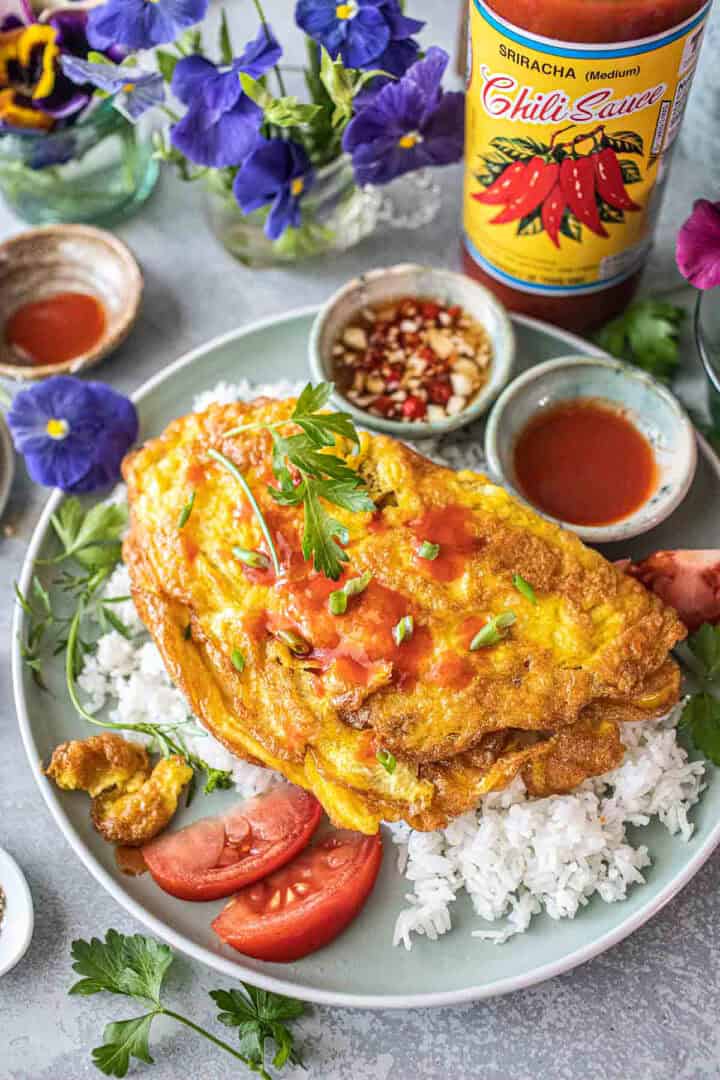 Thai style omelette with spicy dipping sauces on the side.