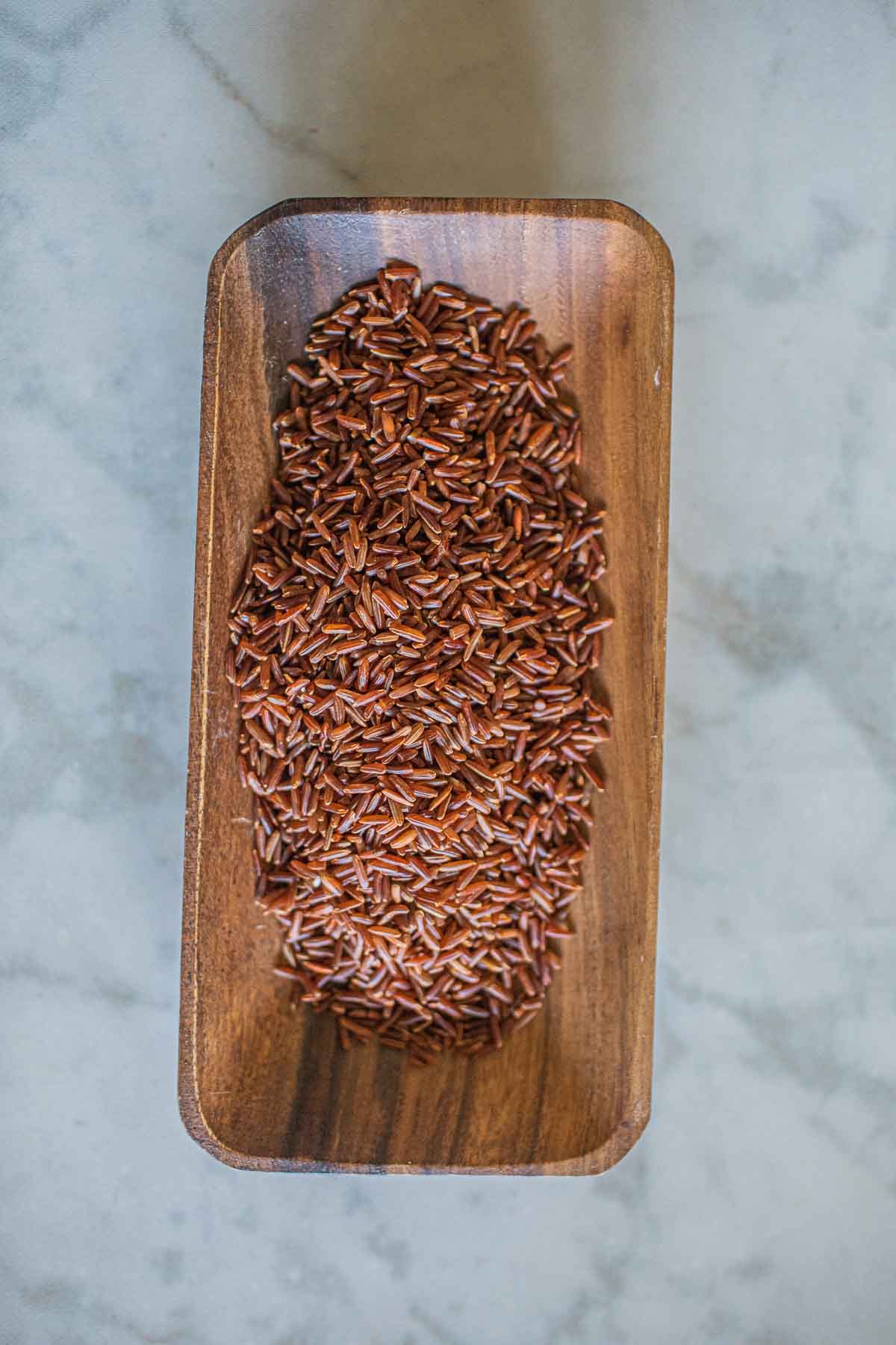 Thai Red rice in a wooden bowl.