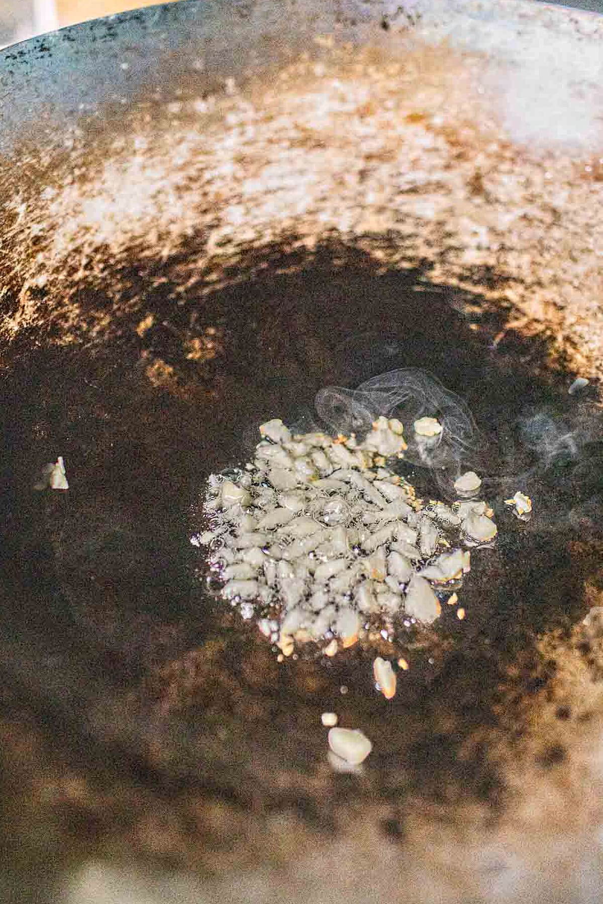 Fried garlic in a wok.