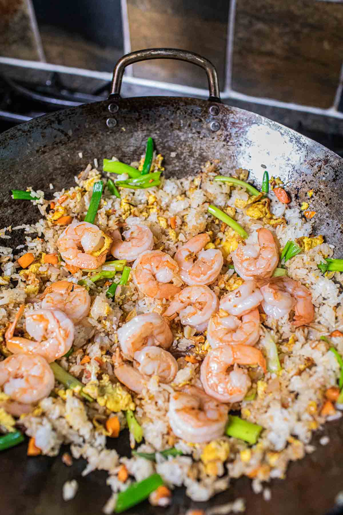 Thai shrimp fried rice in a wok.