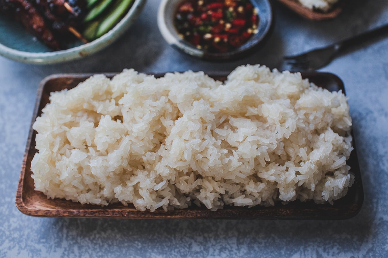 Thai sticky rice in a wooden bowl.