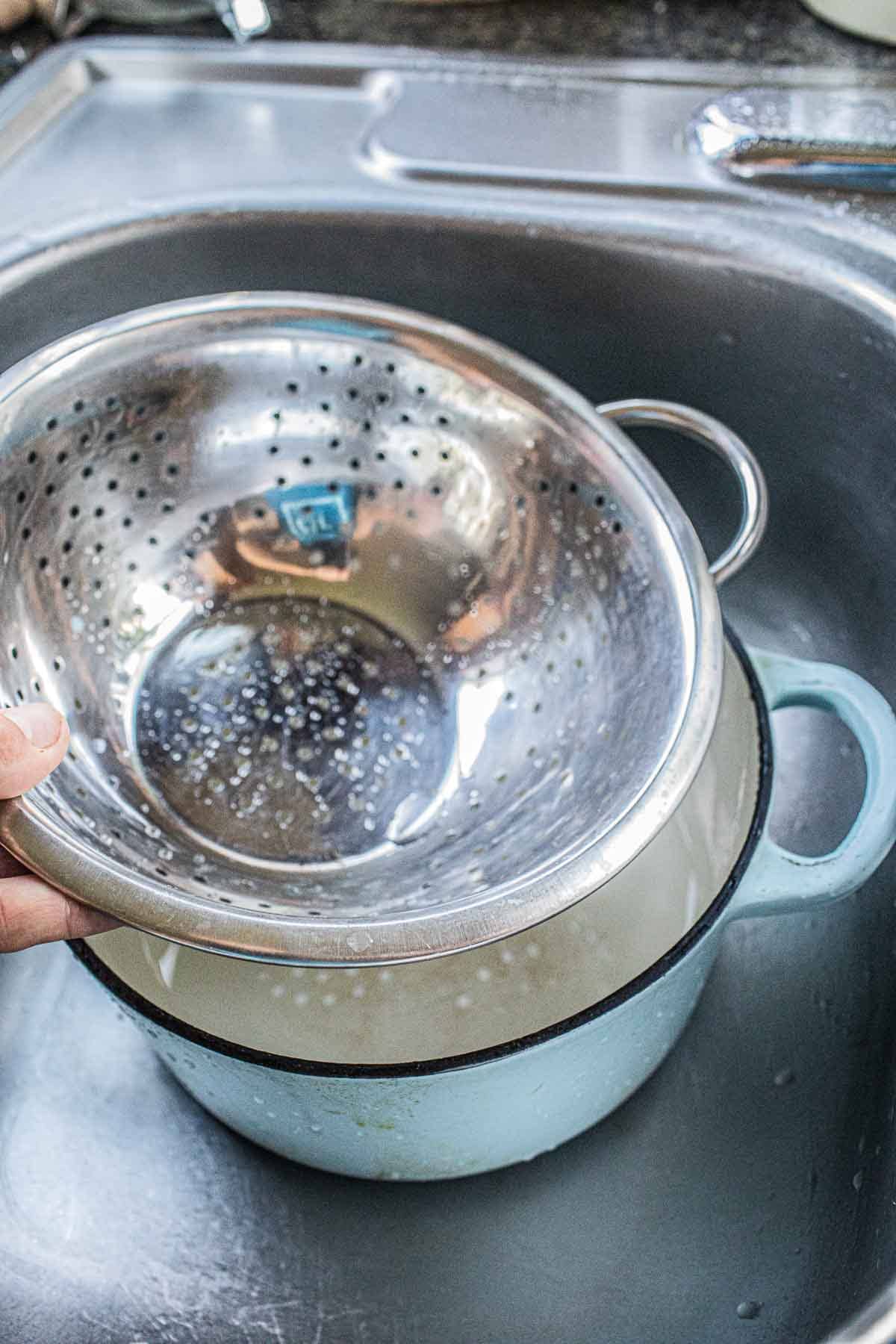 Colander over dutch oven.