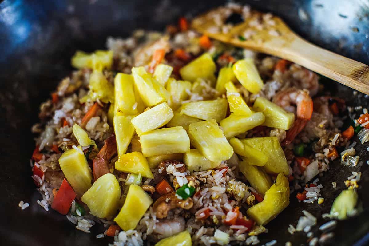 Pineapple in a wok for shrimp pineapple fried rice.  